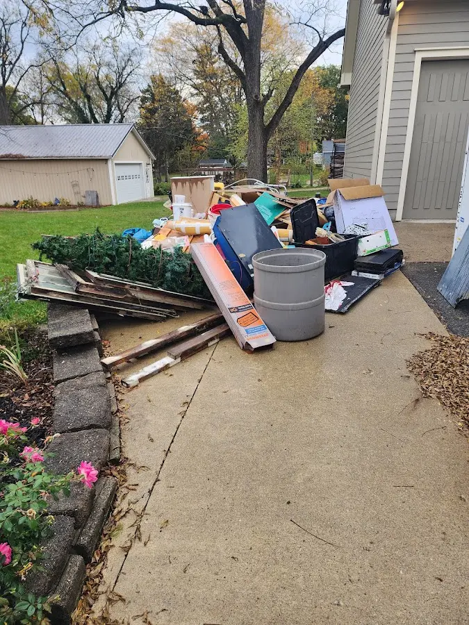Dumpster being loaded with debris for 30 Yard Dumpster Rental in Avondale